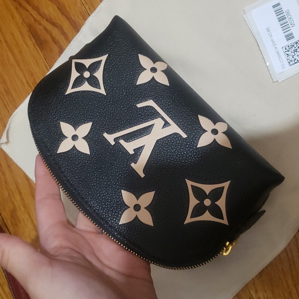 Louis Vuttion Cosmetic pouch in empiri te monogram bicolor leather.Never worn